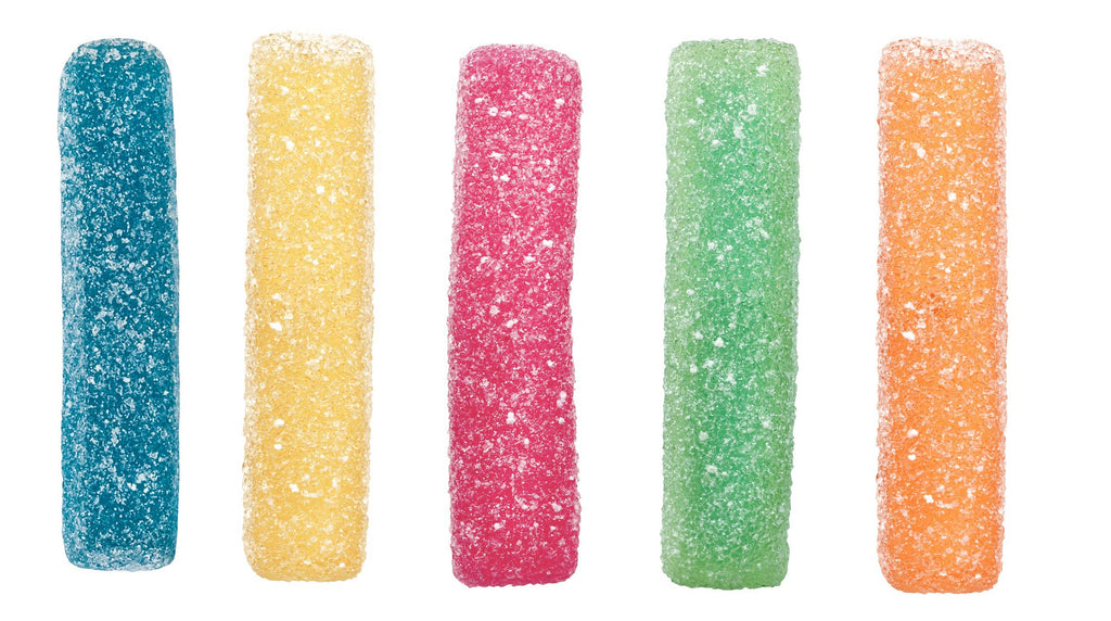 Five colorful gummy worms on a white background