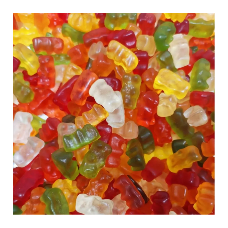 Assorted colorful gummy bears on a white background