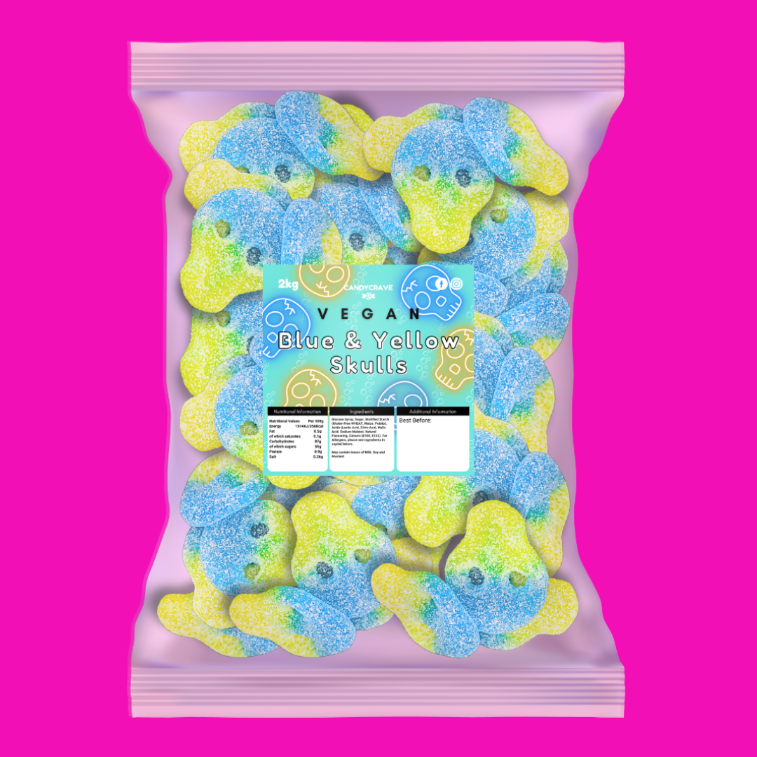 A bag of vegan blue and yellow skull-shaped gummy candies, shown against a solid bright pink background. The packaging is a light pink resealable pouch with a clear window displaying the gummies, and a central label reads 'Skittles Vegan Blue & Yellow Skulls'.